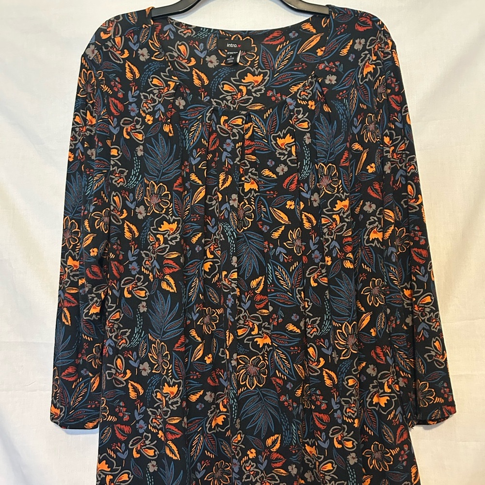 Intro. Vibrant Black Top with Floral Patterns